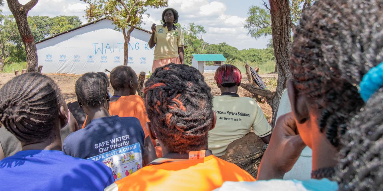 “If you become used to speaking in this group, you can do the same elsewhere,” says refugee Veronica Lakulu, shown here addressing a women’s group. Photo: Elizabeth Stevens/Oxfam.